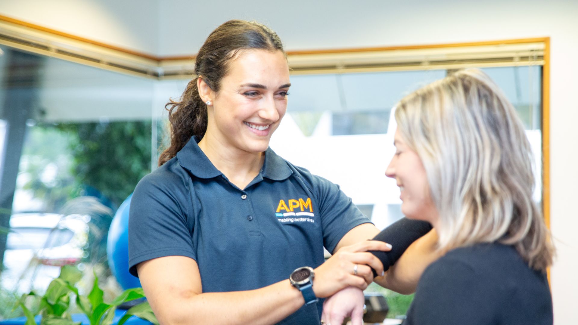 APM Physiotherapist with patient
